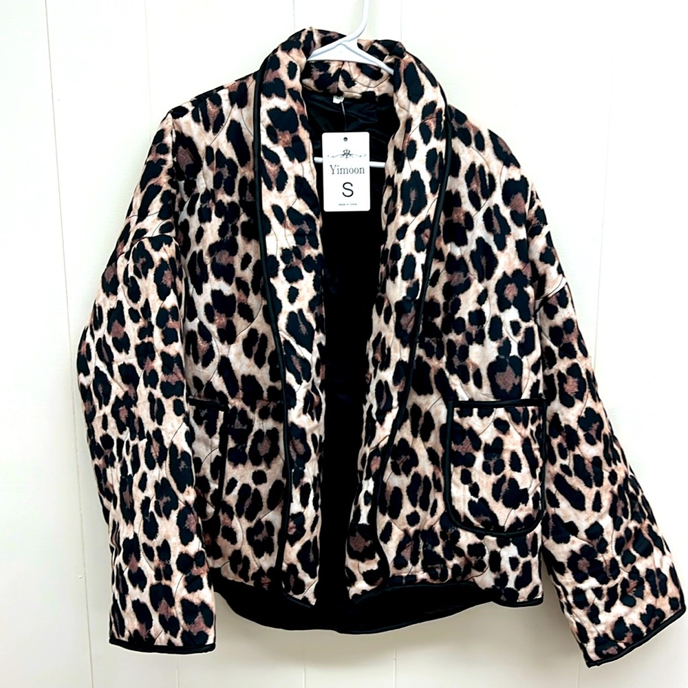 Ladies quilted cardigan. NWT